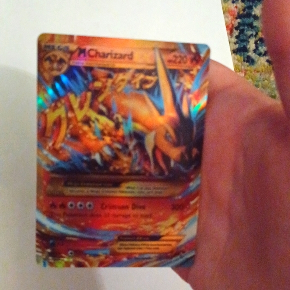 Charizard 2014 gx holo 107/106 Pokémon mint condition has sleeve on it